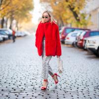   A girl dressed in a fur coat 